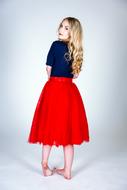 young woman in red skirt
