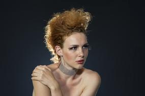 model with a high hairstyle and a necklace