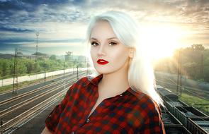 portrait of a blonde girl on a railway station