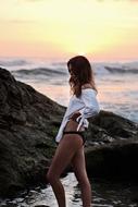 model posing at sunset in white shirt