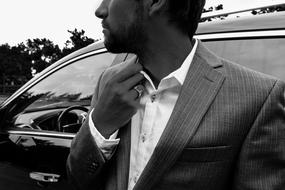 Man in Suit at luxury car