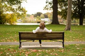 woman sitting alone on the bench