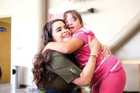 woman hugs a sick child