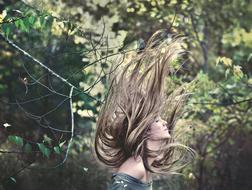 Female Model with long hair in forest