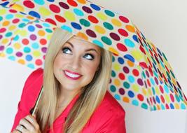 beautiful woman with umbrella at the photo shoot