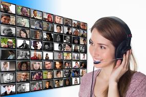 girl with headphones on the background of a digital monitor
