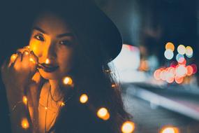 beautiful lady in Christmas lights