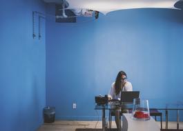 Woman in blue room