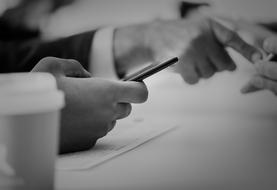 businessman hand holding smartphone