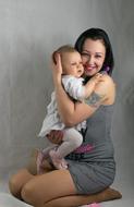 happy mother with cute baby daughter