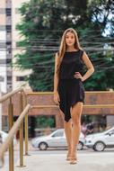 girl in a black dress on a background of wires