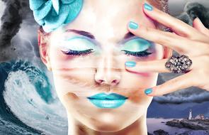 painted girl with blue makeup on a storm background