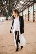 stylish Girl in black and white clothe walking indoor