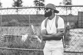 photo of a young man with a beard in a cap