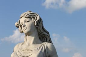 statue of a girl in a cemetery