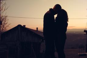 hugging Couple in Love at Sunset