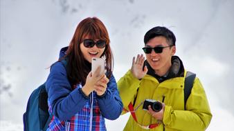 photo of Asian tourists in the Alps