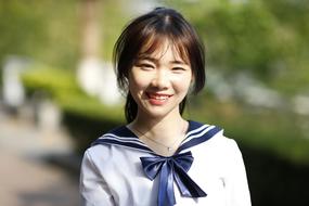 photo of a happy student at Shenzhen Polytechnic University