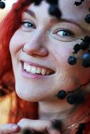red hair woman in berry bush