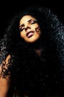 beautiful sensual brunette posing on black background