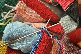 threads and knitting needles close-up