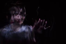 blur portrait of young Woman in darkness