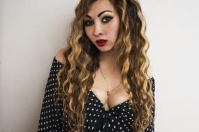 photo of cute girl with long curly hair