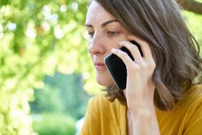 portrait of Woman with smartphone at ear