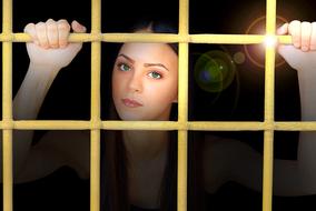 woman in golden cage as conceptual design