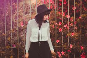 young woman by the fence