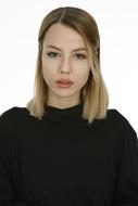 portrait of a young woman in a black sweater