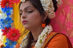 Beautiful Indian Lady, in the colorful and beautiful costume with the flowers