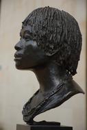 Beautiful, black head statue in Orsay, Paris, France