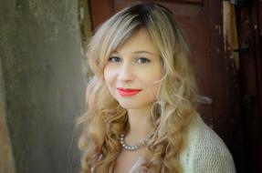 portrait of curly blonde with red lips