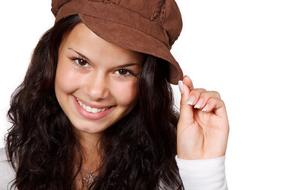 young woman in brown hat