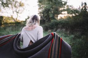 Woman with Back Blanket walking away