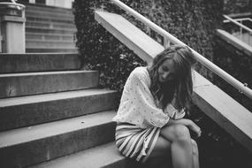 young girl Sitting on Stairs