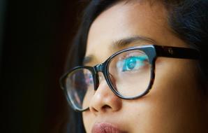 young girl with glasses for sight
