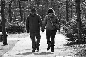 man and woman holding hands