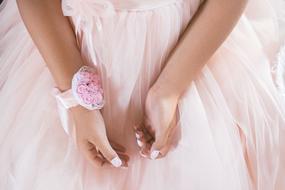 pink dress and a flower on the girl's hand