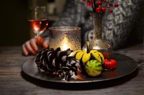 girl sitting at a table with halloween decoration