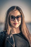 Portrait of Beautiful woman in glasses and black clothing