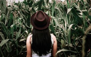 woman in hat on the field