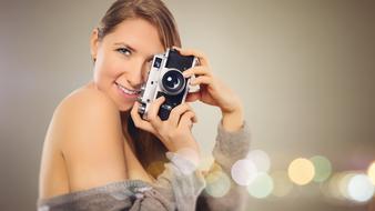 portrait of a woman with camera