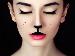 girl with makeup as a cat