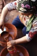 Woman with Handmade Pots
