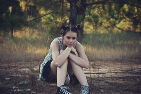 teen Girl Sitting on Grass
