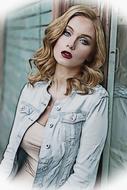 portrait of a girl in a denim jacket near the back