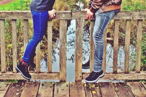 couple on Bridge Railing