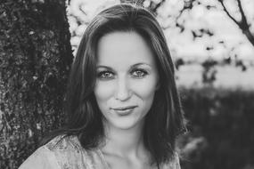 portrait of a beautiful woman near a tree